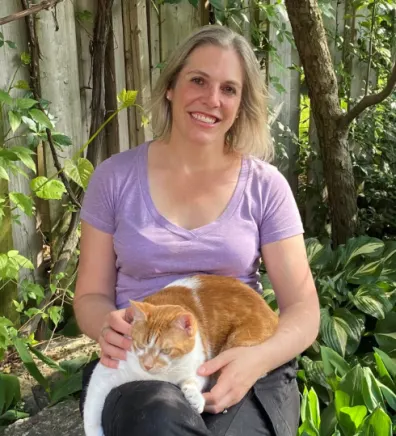 Dr. Emily Simpson Holding a White/Orange Cat